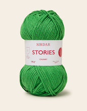 Load image into Gallery viewer, Green skein of yarn with Sirdar Stories label on a beige background