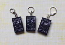 Load image into Gallery viewer, Miniature Book Charm Stitch Marker, Misery, Stephen King inspired