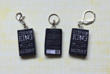 Load image into Gallery viewer, Miniature Book Charm Stitch Marker, Misery, Stephen King inspired
